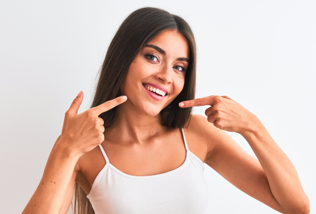 Woman Smiling Pointing Her Teeth