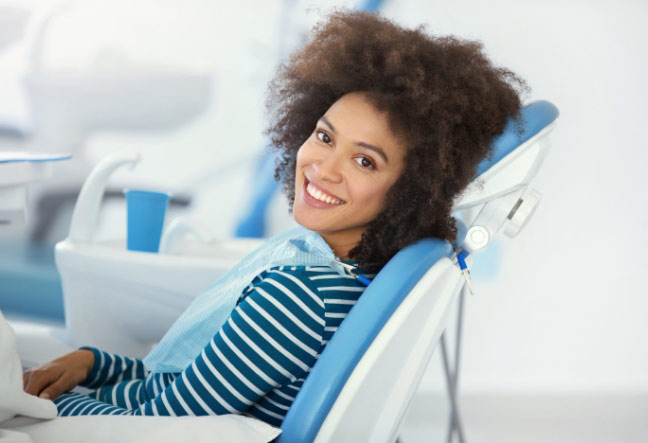 woman-smiling-in-the-dentist-chair